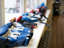 Row of sport boxing gloves on a windowsill royalty free stock image Row of sport boxing gloves on a windowsill royalty free stock image
