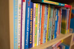 Row of stacked Russian kid books on a shelf. royalty free stock images Row of stacked Russian kid books on a shelf. royalty free stock images