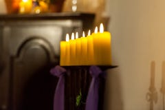 Row of yellow candles in the church royalty free stock photography Row of yellow candles in the church royalty free stock photography