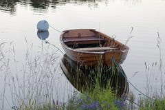 Rowboat in calm water in the harbour royalty free stock photography Rowboat in calm water in the harbour royalty free stock photography