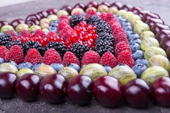 Rows of assorted fruits and berries: sweet cherry, bluberries, r royalty free stock image Rows of assorted fruits and berries: sweet cherry, bluberries, r royalty free stock image