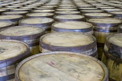 Rows of oak barrels in bourbon distillery stock image Rows of oak barrels in bourbon distillery stock image