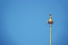The Royal Nine-Tiered Umbrella Thailand ,Tiered umbrella with blue background, the highest point of the temple stock images The Royal Nine-Tiered Umbrella Thailand ,Tiered umbrella with blue background, the highest point of the temple stock images