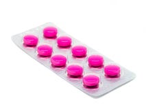 Roze die tablettenpillen in blaarpak op witte achtergrond wordt geïsoleerd Royalty-vrije Stock Afbeelding Roze die tablettenpillen in blaarpak op witte achtergrond wordt geïsoleerd Royalty-vrije Stock Afbeelding