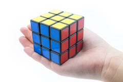 Rubik`s cube is holden by hand isolated on white background royalty free stock photography Rubik`s cube is holden by hand isolated on white background royalty free stock photography
