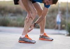 Runner touching painful twisted or broken ankle. royalty free stock image Runner touching painful twisted or broken ankle. royalty free stock image