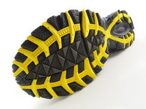 Running Shoe with yellow and black tread pattern royalty free stock photography Running Shoe with yellow and black tread pattern royalty free stock photography