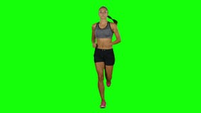 Running sport girl. Front view. Green screen