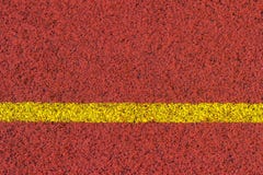 Running track rubber standard red color and yellow line royalty free stock photography Running track rubber standard red color and yellow line royalty free stock photography