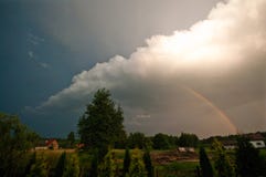 Rural Poland, Ilawa region, rainbow over village of Sapy Stock Images Rural Poland, Ilawa region, rainbow over village of Sapy Stock Images
