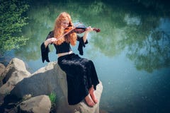 Rural red-haired girl with a violin royalty free stock photos Rural red-haired girl with a violin royalty free stock photos