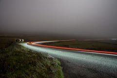 Rural road at night in the fog - cat and fiddle Royalty Free Stock Photo Rural road at night in the fog - cat and fiddle Royalty Free Stock Photo