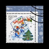 Snowman group with envelope to Father Frost aka Santa Claus, snowflake for Christmas, Russia, circa 2006, royalty free stock image Snowman group with envelope to Father Frost aka Santa Claus, snowflake for Christmas, Russia, circa 2006, royalty free stock image