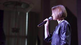 RUSSIA, MOSCOW - APRIL 13, 2019: Woman on stage gives business training. Art. Woman animatedly explains to large female stock images RUSSIA, MOSCOW - APRIL 13, 2019: Woman on stage gives business training. Art. Woman animatedly explains to large female stock images