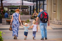 Russia, Rostov On Don, September 09, 2018: Happy Family Walk With Two Cute Blondy Kids On Street Of City Stock Photography