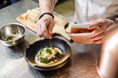 Russia, St. Petersburg, 03.17.2019-Chef prepares beef steak tenderloin in the restaurant kitchen. royalty free stock image Russia, St. Petersburg, 03.17.2019-Chef prepares beef steak tenderloin in the restaurant kitchen. royalty free stock image