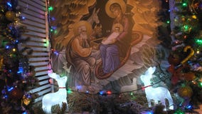 RUSSIA, VLADIMIR, 25 DEC 2019: Jesus birth orthodox icon near Christmas tree