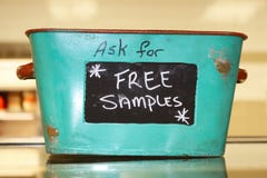 Rustic tin basket sitting on counter that says Ask for free samples stock photos Rustic tin basket sitting on counter that says Ask for free samples stock photos