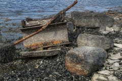 Rusty garbage by the ocean stock photos Rusty garbage by the ocean stock photos