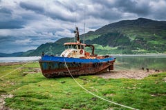 Rusty Shipwreck On Shore In Summer, Scotland, UK Stock Image Rusty Shipwreck On Shore In Summer, Scotland, UK Stock Image