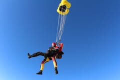 Tandem skydiving. Two men are in the sky. royalty free stock photo Tandem skydiving. Two men are in the sky. royalty free stock photo