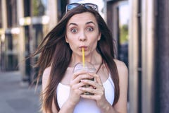 It`s so sweet sugary! Close up photo portrait of satisfied cheerful excited pretty with pop big eyes girls holding soda using yel stock photos It`s so sweet sugary! Close up photo portrait of satisfied cheerful excited pretty with pop big eyes girls holding soda using yel stock photos