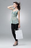 Sac à provisions de fixation de Brunette image stock Sac à provisions de fixation de Brunette image stock