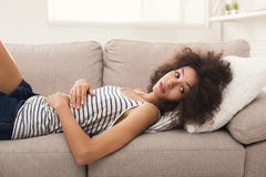 Sad African-american Woman On Couch At Home Stock Images