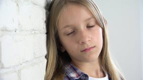 Sad child, unhappy kid, sick ill girl in depression, stressed thoughtful person stock footage Sad child, unhappy kid, sick ill girl in depression, stressed thoughtful person stock footage