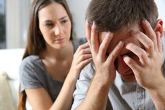 Sad man and a friend consoling stock images Sad man and a friend consoling stock images