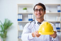 The safety doctor advising about wearing hard hat stock photo The safety doctor advising about wearing hard hat stock photo