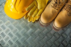 Safety Gloves Boots Hard Hat On Corrugated Metal Plate Stock Photos