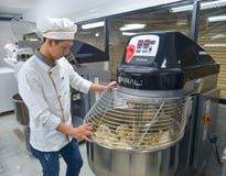 Bread process by using flour mixing machine stock image Bread process by using flour mixing machine stock image