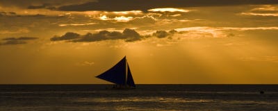 Sailing At Sunset Stock Photo