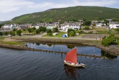 Sailing Boat Going Passed Helmsdale Old Harbour, Helmsdale, Sutherland, Scotland, U.K Stock Photography Sailing Boat Going Passed Helmsdale Old Harbour, Helmsdale, Sutherland, Scotland, U.K Stock Photography
