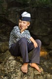 Sailor Boy Sitting On A Stone Stock Photo Sailor Boy Sitting On A Stone Stock Photo