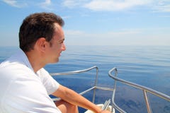 Sailor man sailing boat blue calm ocean water Royalty Free Stock Photography Sailor man sailing boat blue calm ocean water Royalty Free Stock Photography
