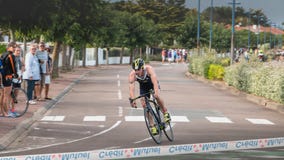 Leading cyclist in a turn on the French Championship final triathlon stock image Leading cyclist in a turn on the French Championship final triathlon stock image
