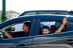 Saint-Petersburg. RUSSIA. 05.18.2018. Mom driving a car with children stock photos Saint-Petersburg. RUSSIA. 05.18.2018. Mom driving a car with children stock photos