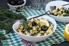 Salad with chicken, cheese and black olives in white bowls on the table royalty free stock photos Salad with chicken, cheese and black olives in white bowls on the table royalty free stock photos