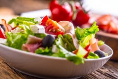 Salad. Fresh summer lettuce salad.Healthy mediterranean salad olives tomatoes parmesan cheese and prosciutto royalty free stock images Salad. Fresh summer lettuce salad.Healthy mediterranean salad olives tomatoes parmesan cheese and prosciutto royalty free stock images