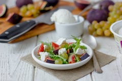 Salad with goat chees, arugula and figs. Royalty Free Stock Photos Salad with goat chees, arugula and figs. Royalty Free Stock Photos