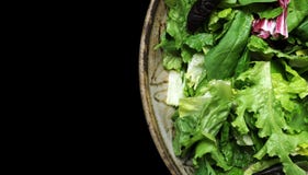 Salad In Bowl Isolated On Black Royalty Free Stock Photo