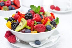 Salad Of Fresh Fruit And Berries In A Bowl Stock Photos