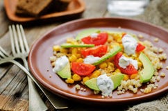 Salad with quinoa, red lentils, corn, avocado and tomato with yo Stock Photos Salad with quinoa, red lentils, corn, avocado and tomato with yo Stock Photos