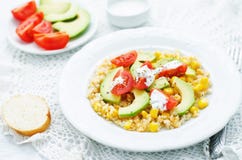 Salad with quinoa, red lentils, corn, avocado and tomato with yo Royalty Free Stock Photos Salad with quinoa, red lentils, corn, avocado and tomato with yo Royalty Free Stock Photos
