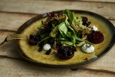 Salad with roasted beetroot, spinach, soft goat cheese stock photography Salad with roasted beetroot, spinach, soft goat cheese stock photography
