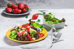 Salad from strawberry, cheese. Salad on a yellow plate. stock image Salad from strawberry, cheese. Salad on a yellow plate. stock image