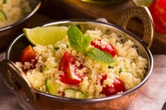 Salada do cuscuz com vegetais imagem de stock Salada do cuscuz com vegetais imagem de stock
