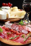 Salami and cheese platter with herbs royalty free stock photography Salami and cheese platter with herbs royalty free stock photography